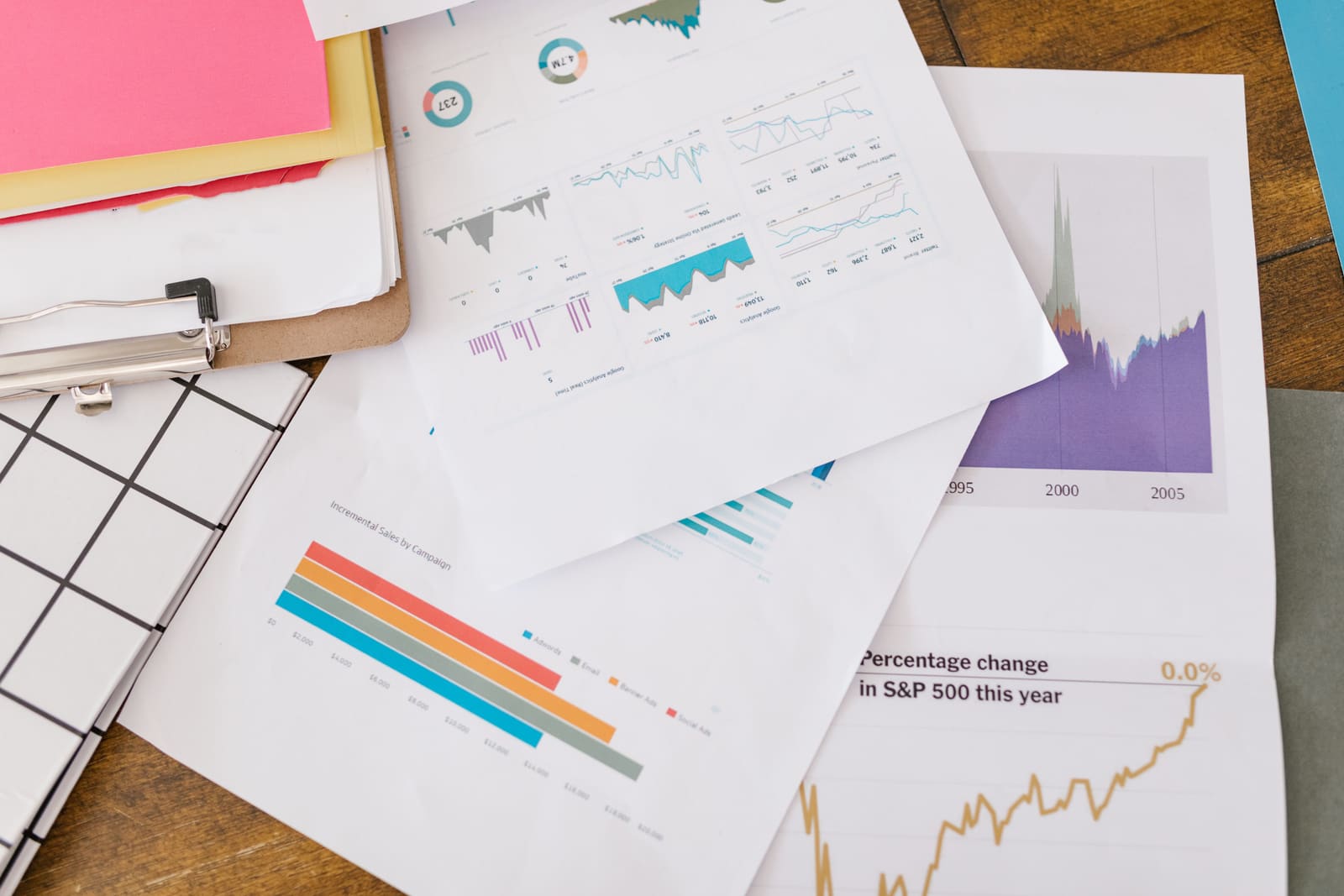 Printed charts and reports on a desk